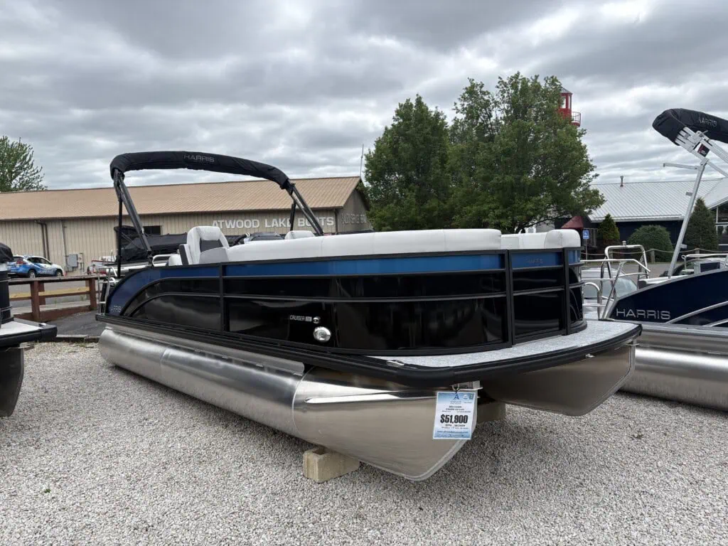 Harris pontoon boat on dealership lot