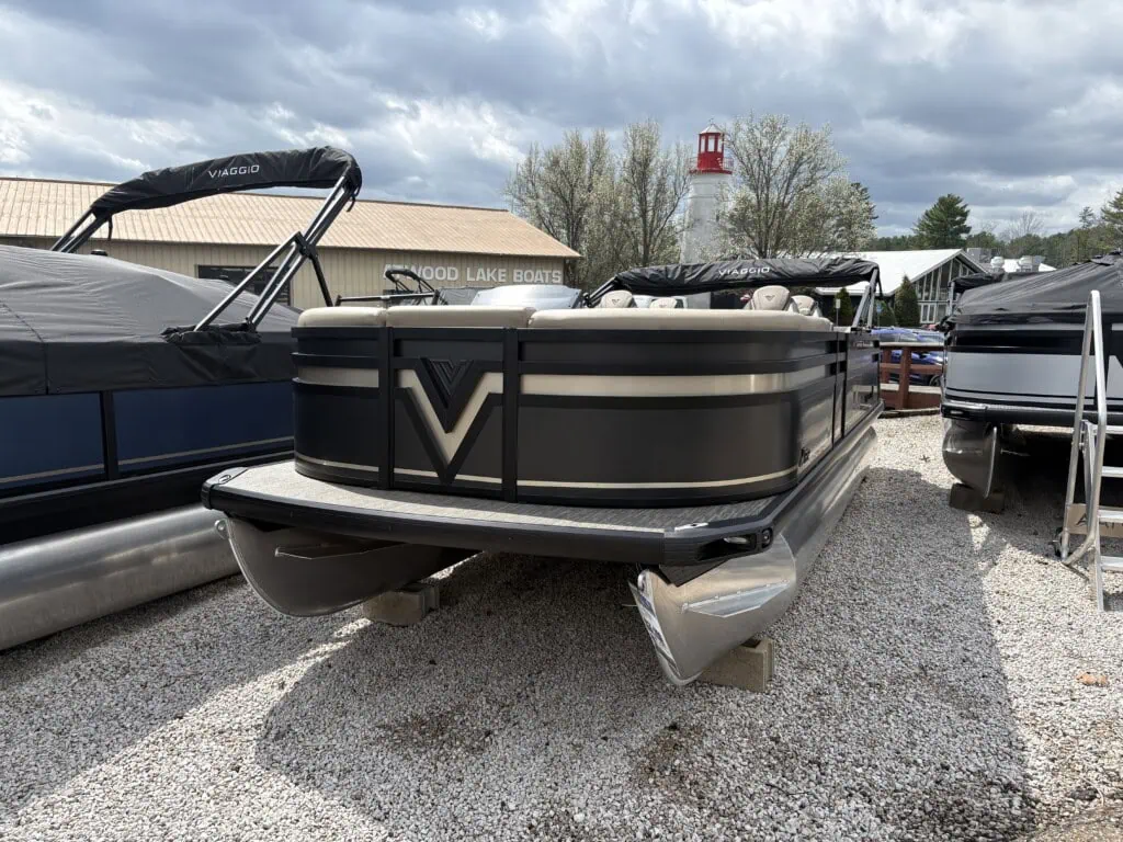 Pontoon boats on display at lakeside dealership