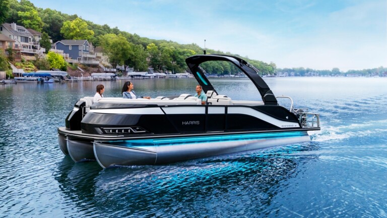 Family on the lake in a Harris Tritoon boat