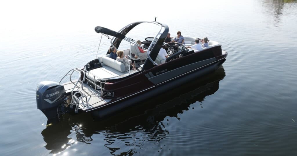 People on a Sylvan pontoon on the water