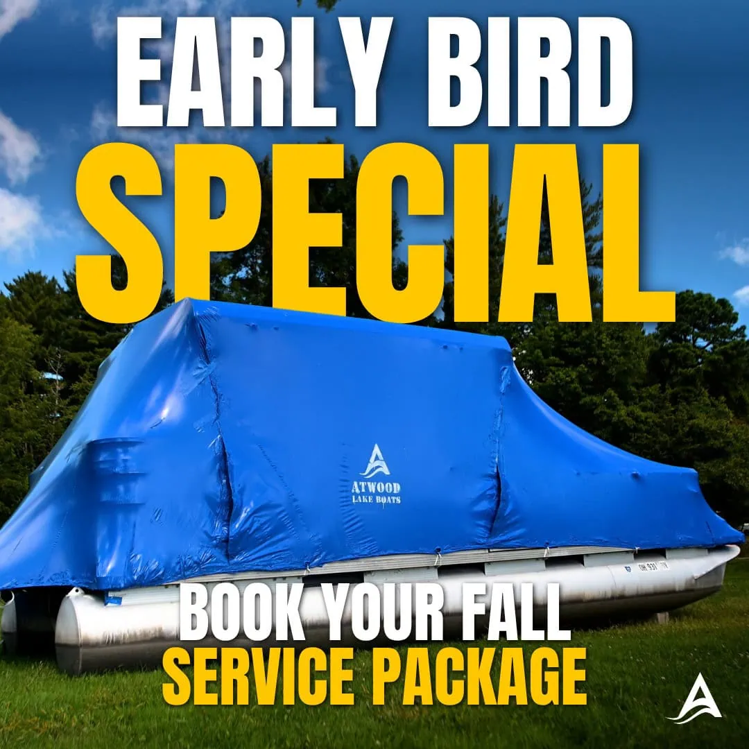 Promotional graphic showing a pontoon boat covered in a bright blue protective tarp on grass, with trees and a blue sky behind it. Large white and yellow text reads “Early Bird Special” and “Book Your Fall Service Package,” alongside the Atwood Lake Boats logo.