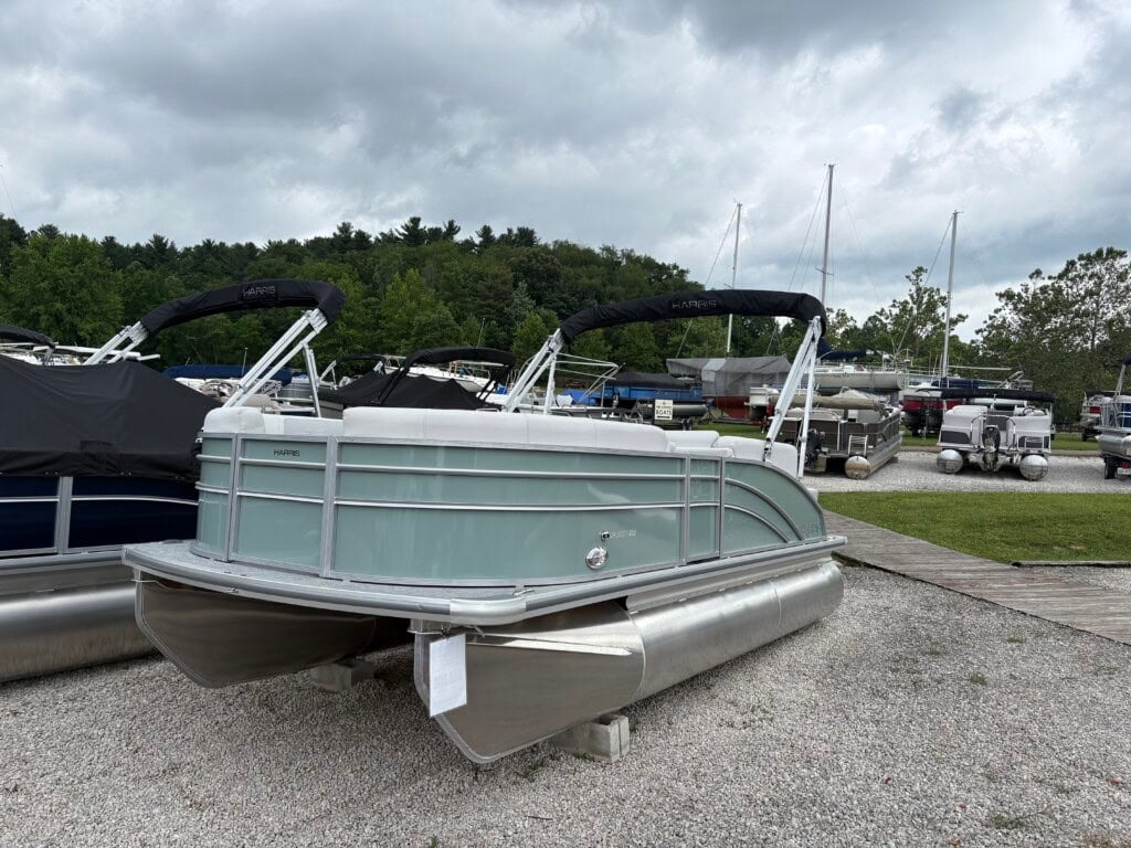 Pontoon boats on display at marina lot