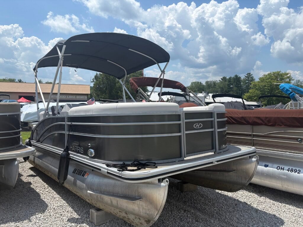 Pontoon boat displayed at a boat dealership