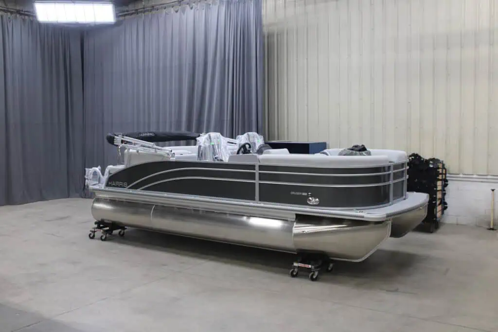 Gray pontoon boat in storage facility