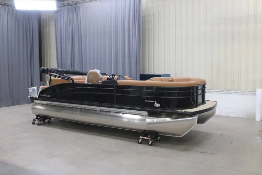 Modern pontoon boat in indoor showroom