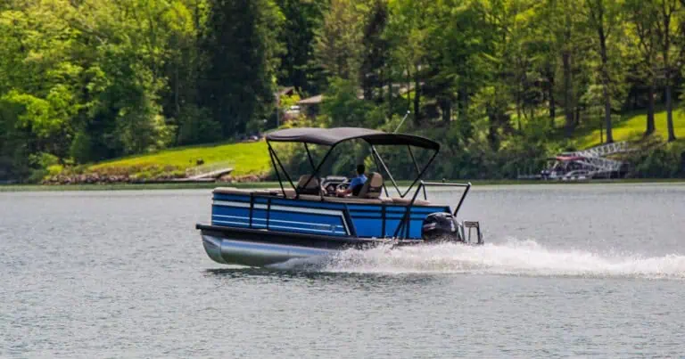 Blue Viaggio pontoon boat cruising on Atwood Lake.